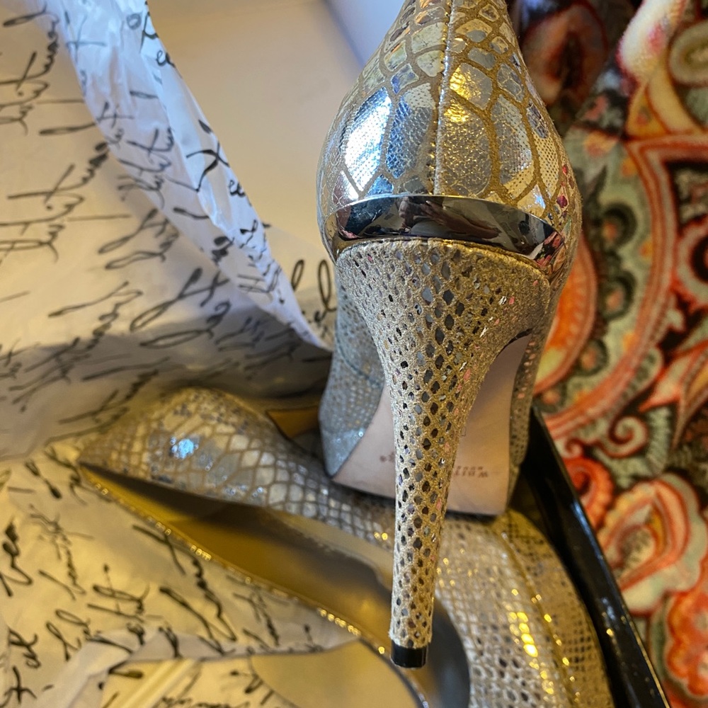 Gently worn. Mirrored soft leather pumps